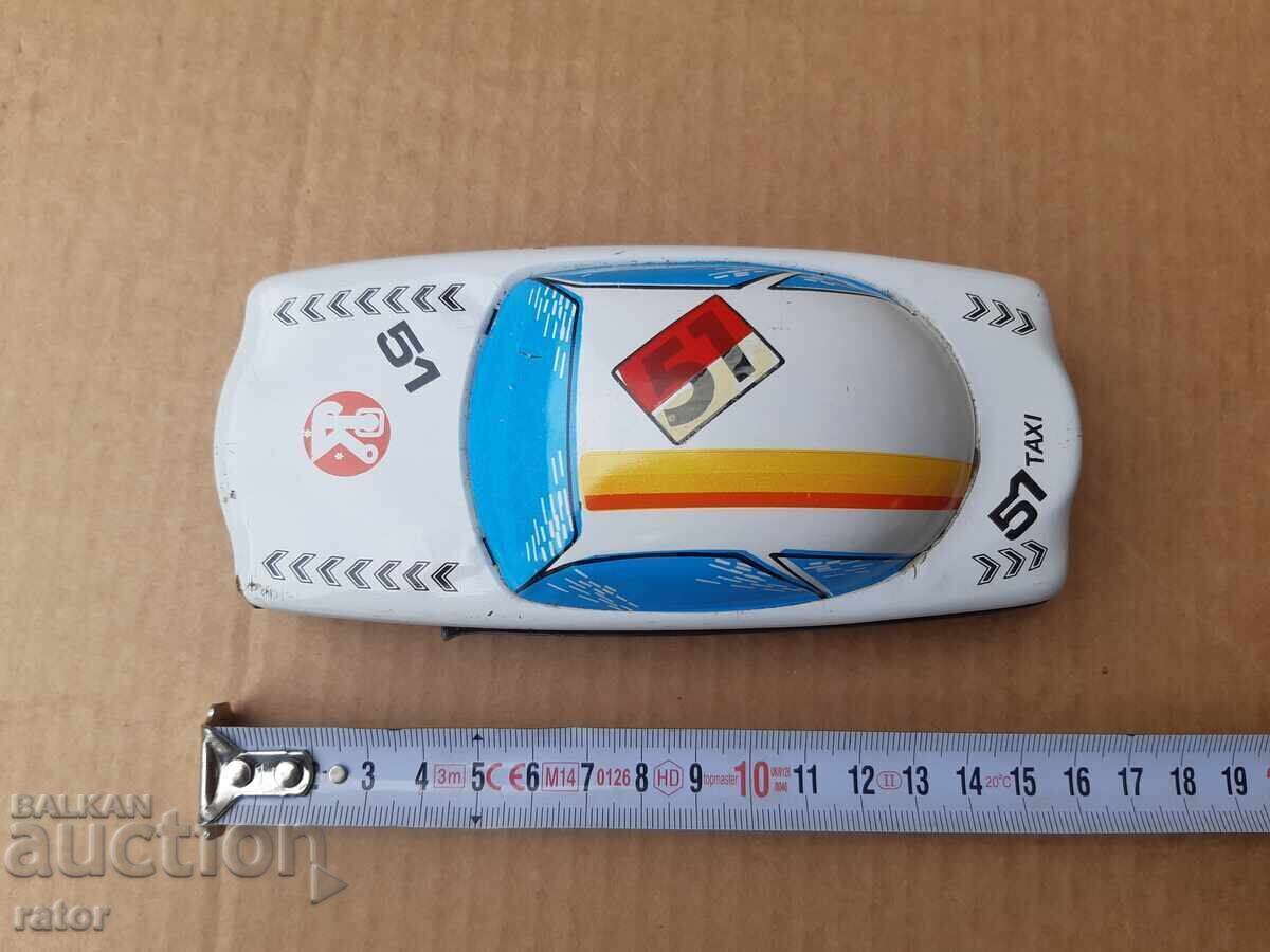 Auction  Old tin car, taxi, toy. Works