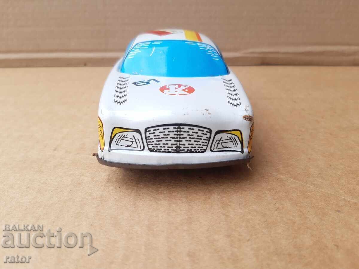 Delivery of Old tin car, taxi, toy. Works