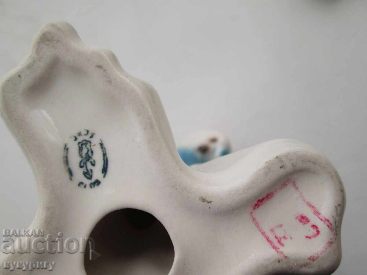 Auction  Old porcelain figurine of a parrot