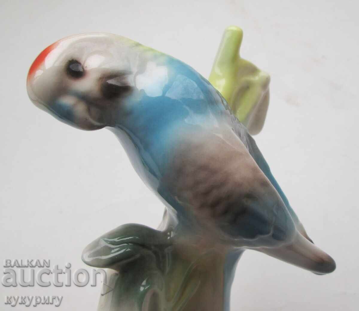 Old porcelain figurine of a parrot