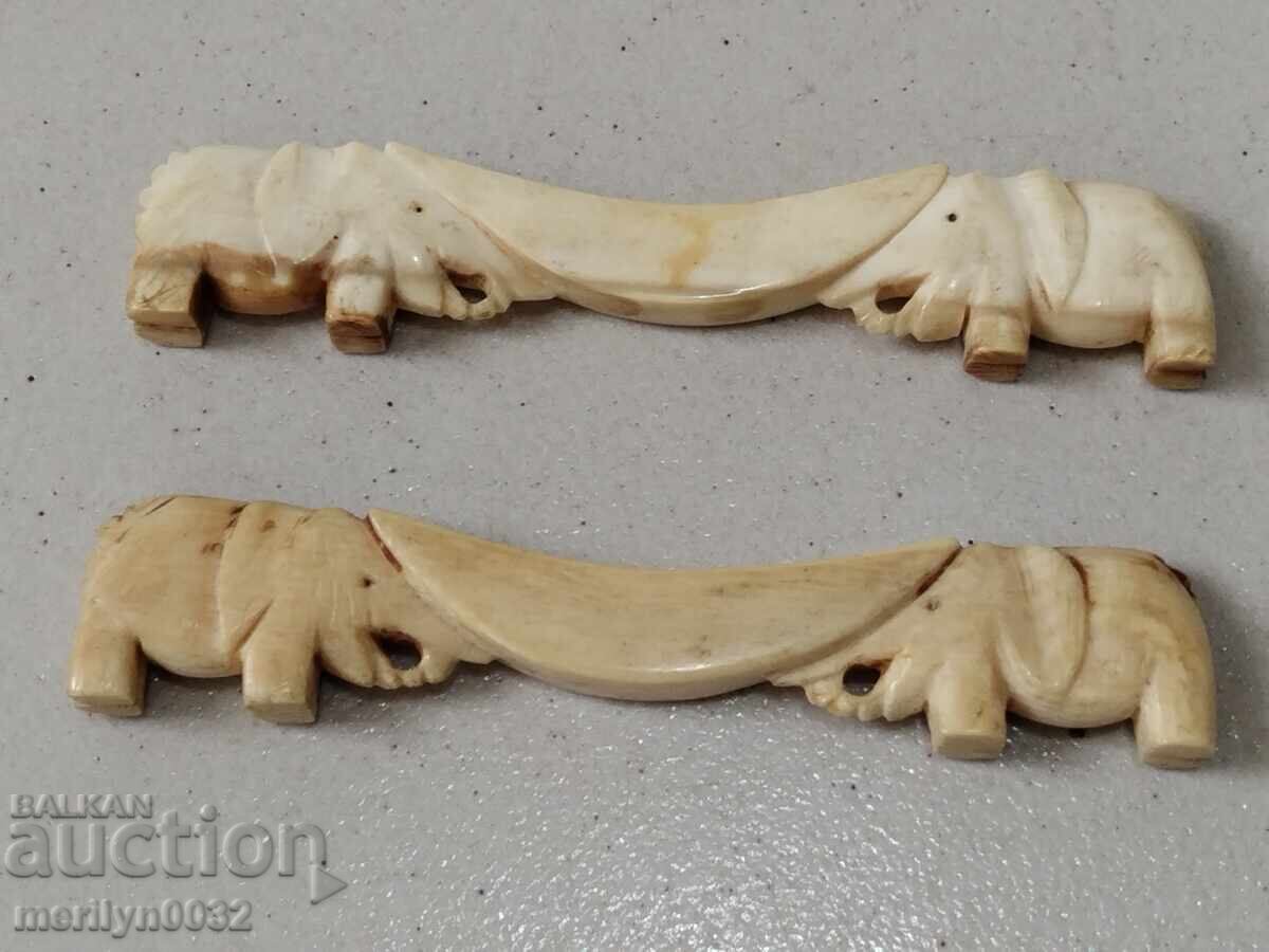 Ivory elephant stands for silverware