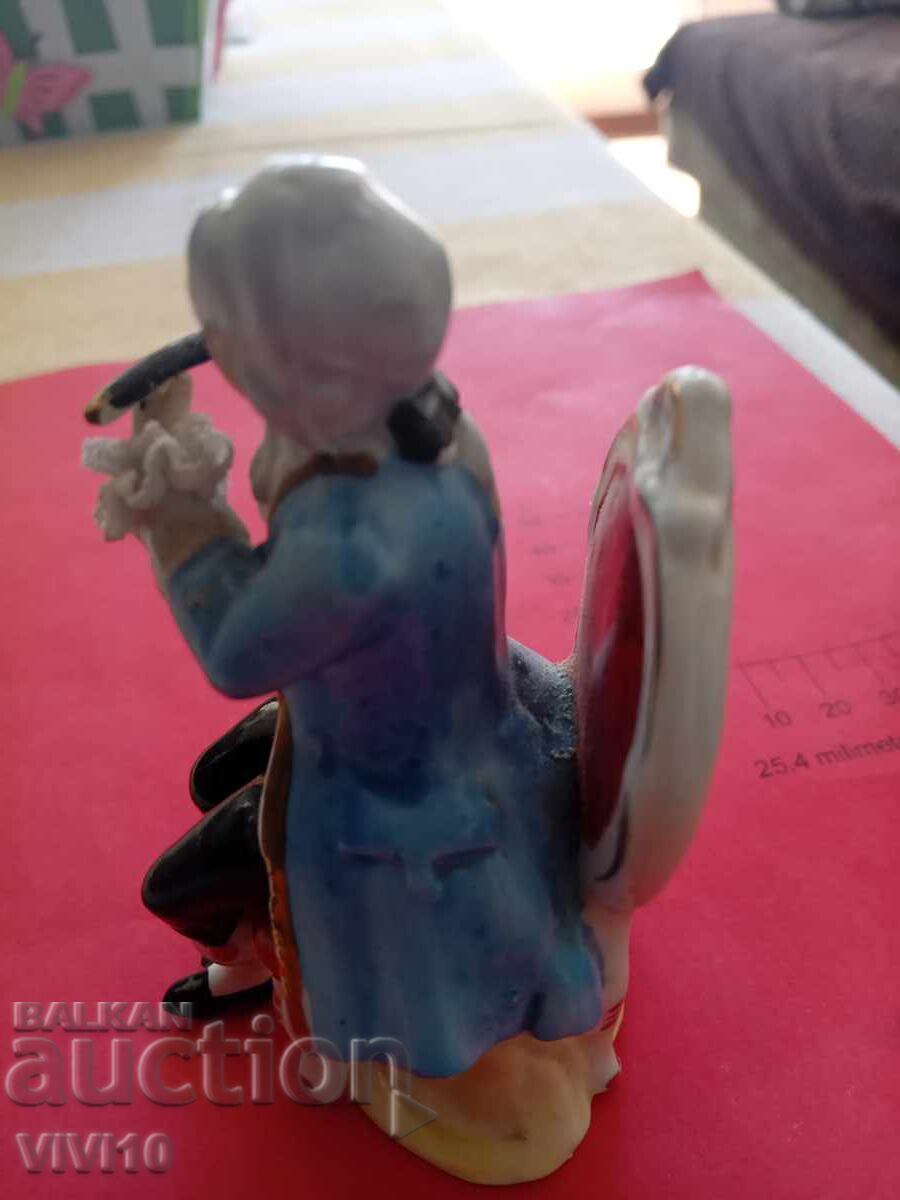 Delivery of Antique porcelain figure, marked