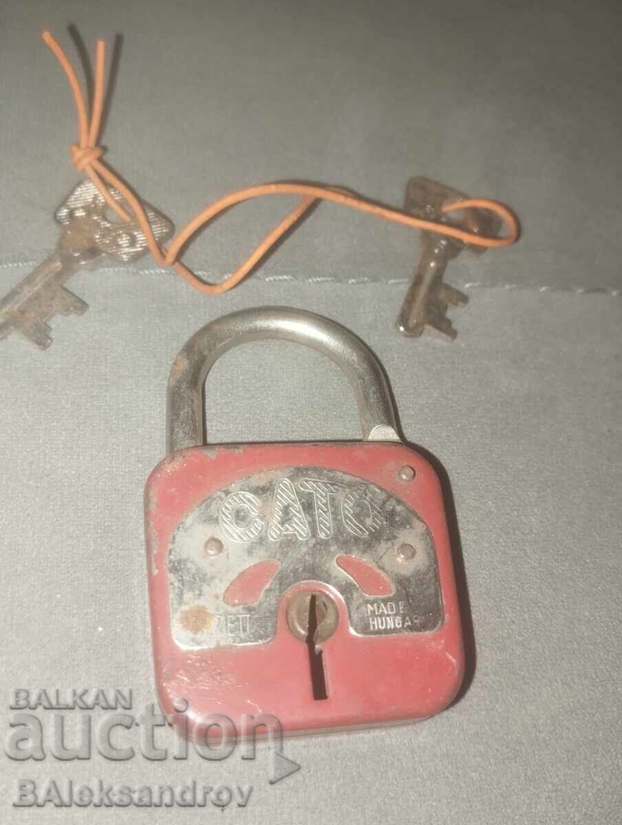 Old padlock with two keys Old padlock with two keys