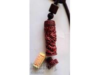 Cinnabar amulet pendant with a secret compartment