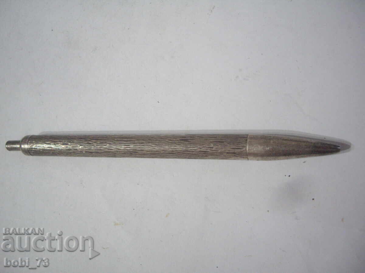 An old silver pen. An old silver pen.