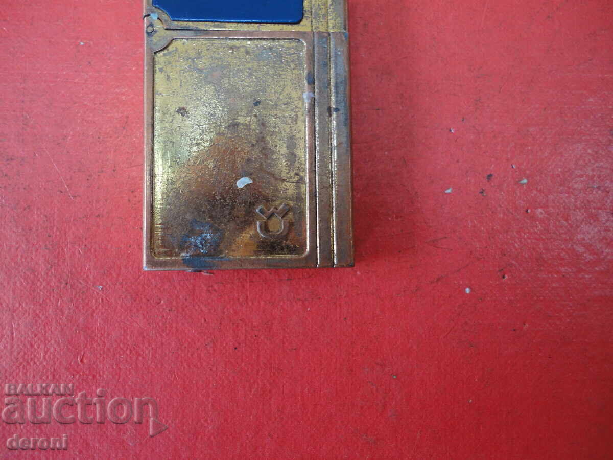 Auction  Great enamel lighter