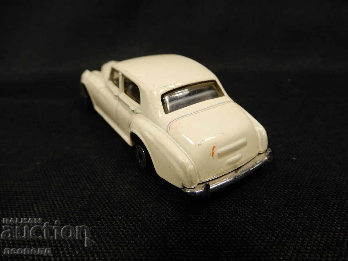 Licitație VECHE CĂRUȚĂ METALICĂ RETRO MATCHBOX MACAU ROLLS-ROYCE