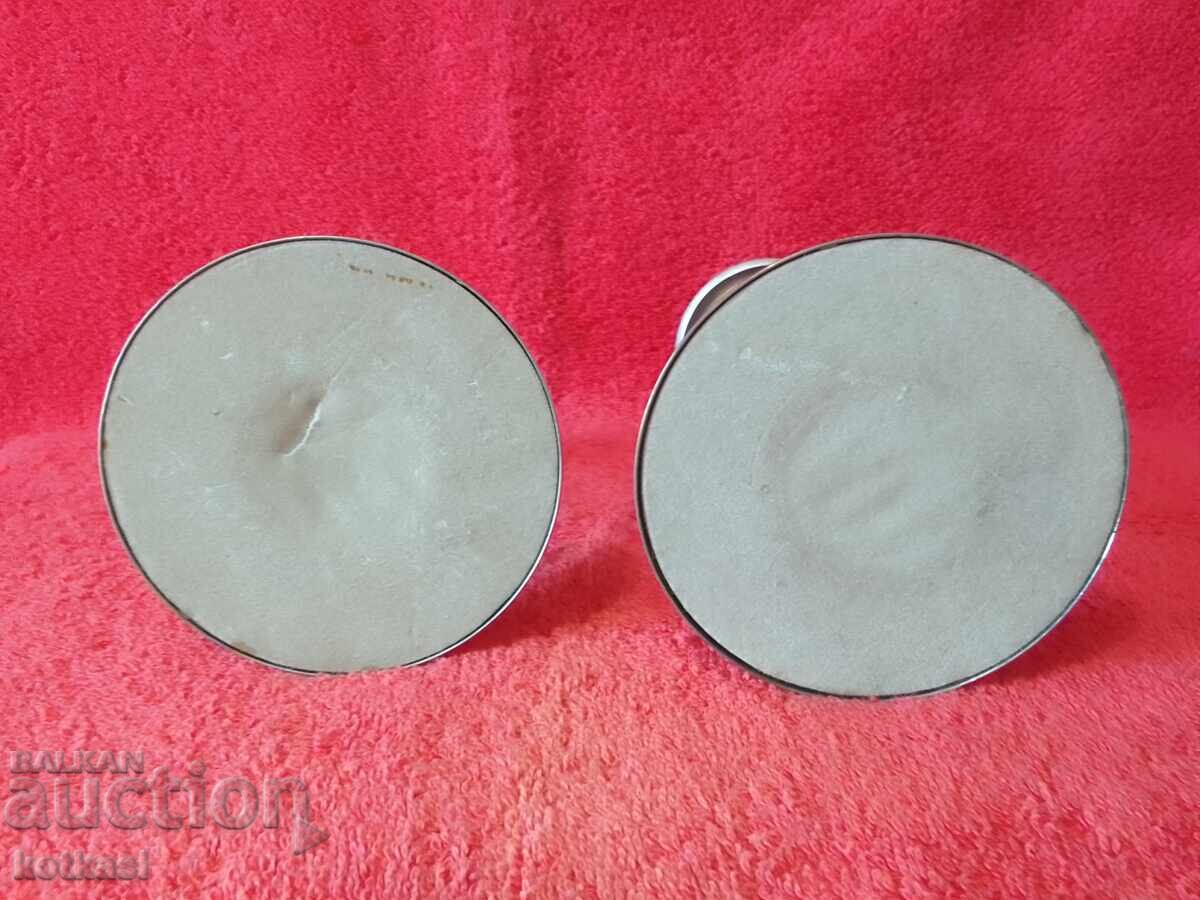 Delivery of Lot of two old metal candlesticks Delivery of Lot of two old metal candlesticks