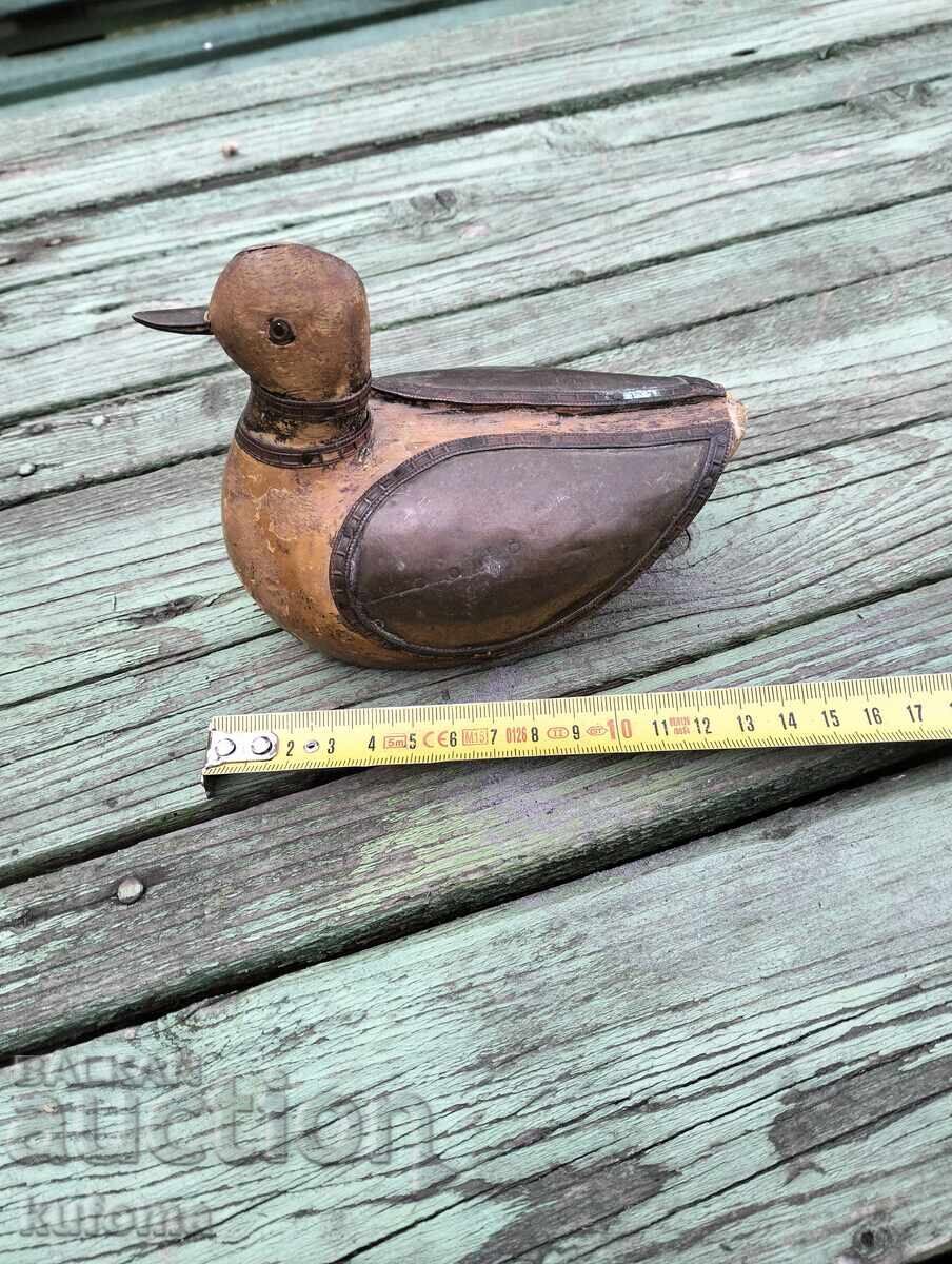Auction  Wooden duck with brass fittings