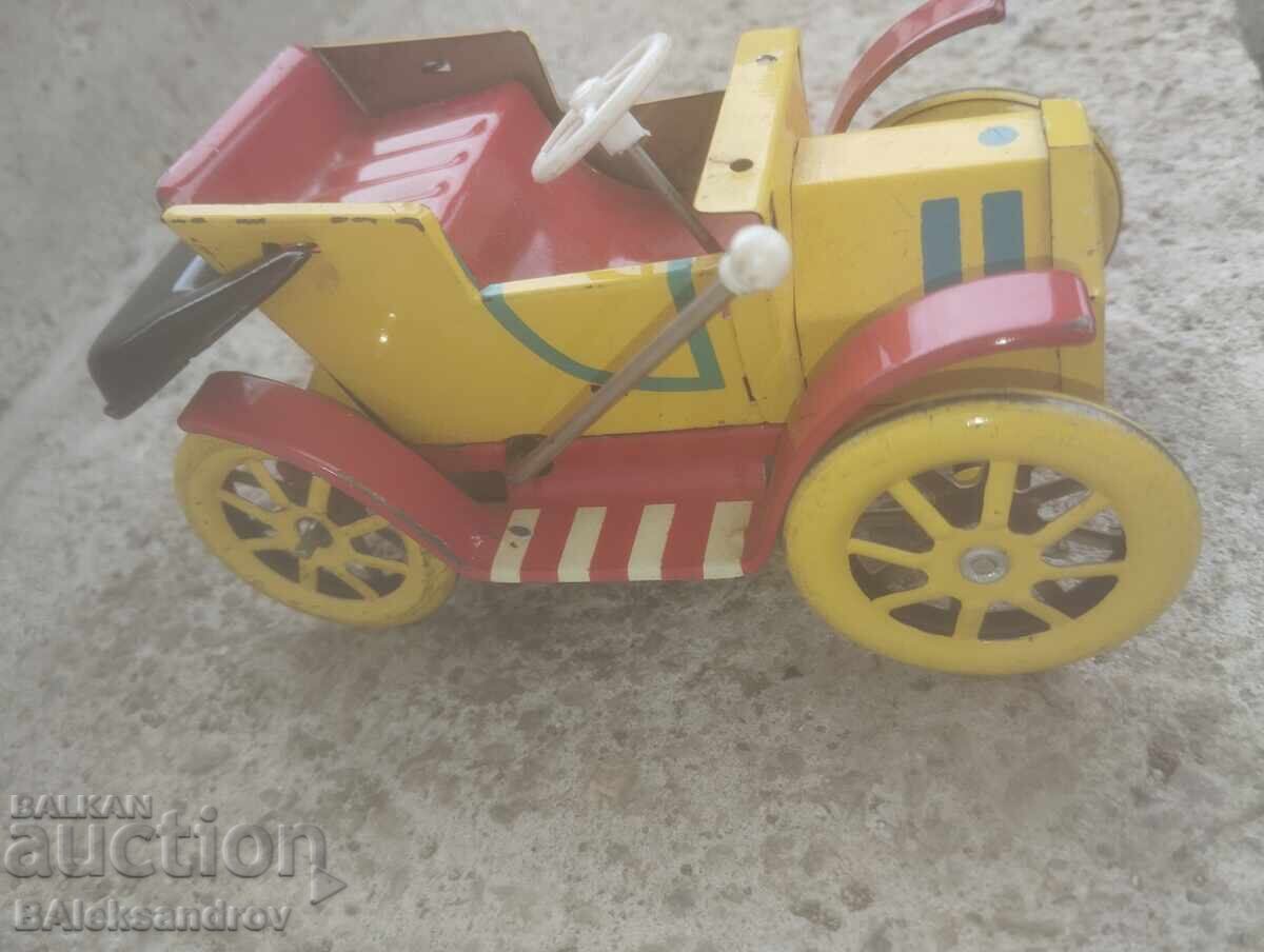 Auction  An old tin toy
