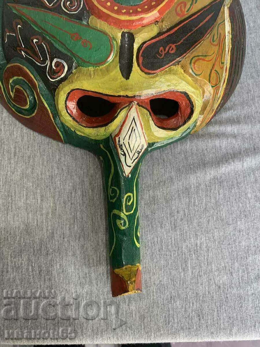 Auction painted wooden mask Auction painted wooden mask