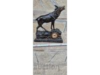 Old sculpture, figure of a deer. Clock. Inkwell