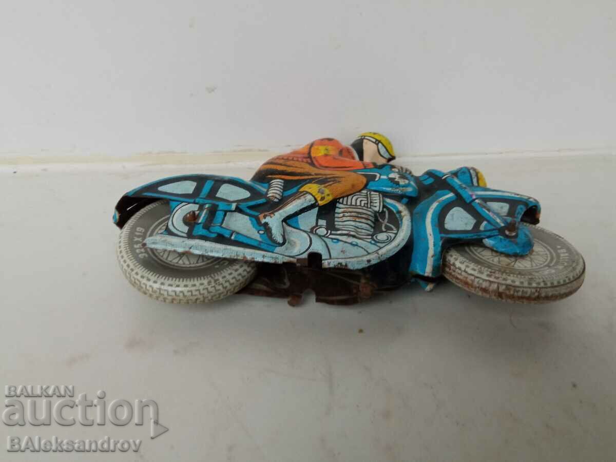 Παράδοση Παλιό τσίγκινο παιχνίδι ποδηλάτης