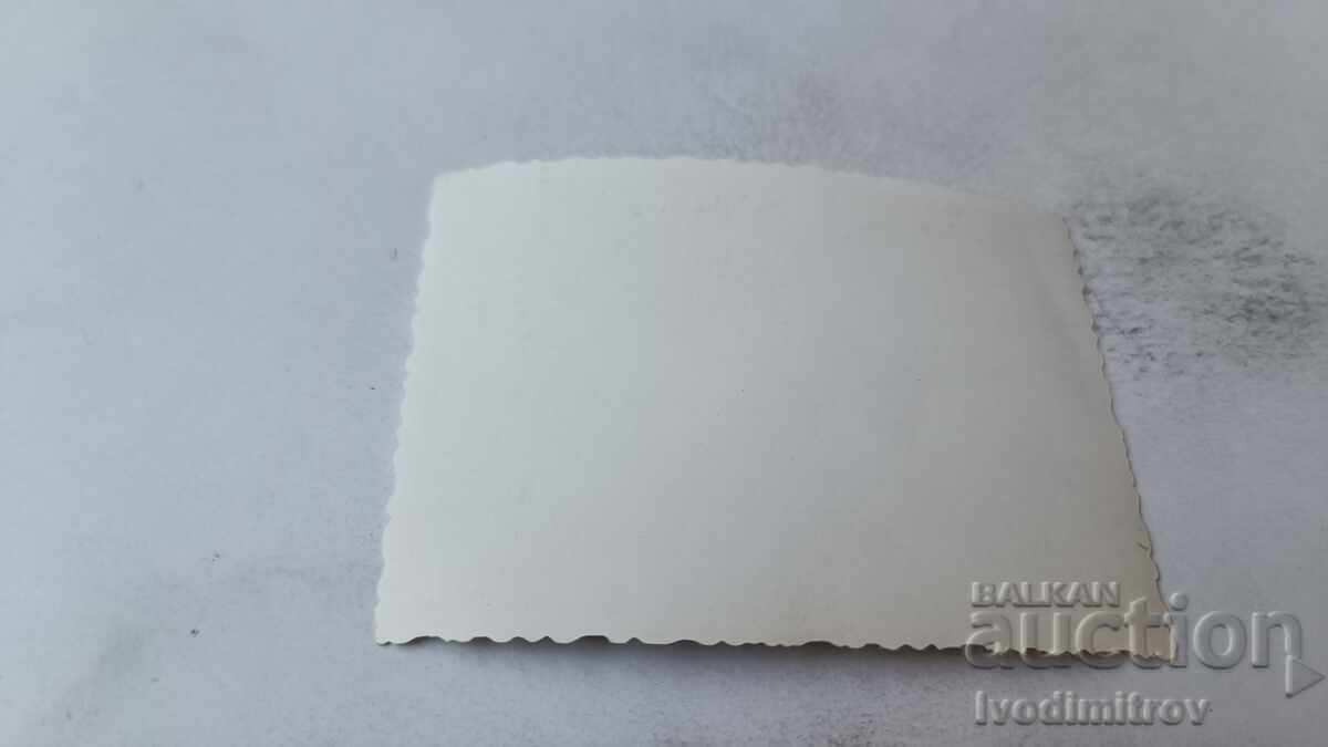 Снимка Млада жена на скала в морето с цена 1.85 лв. | € 0.95