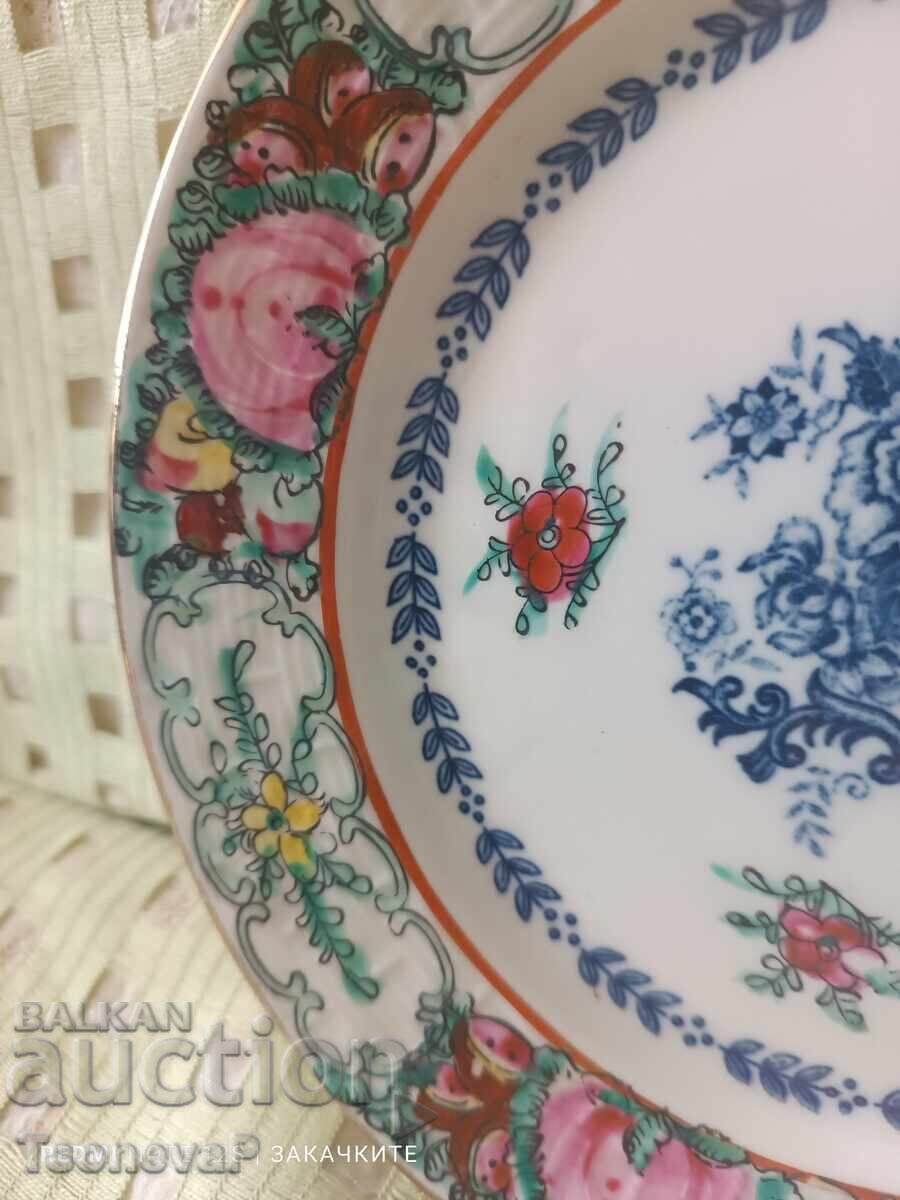 Auction  Decorative porcelain plate with a spring for hanging
