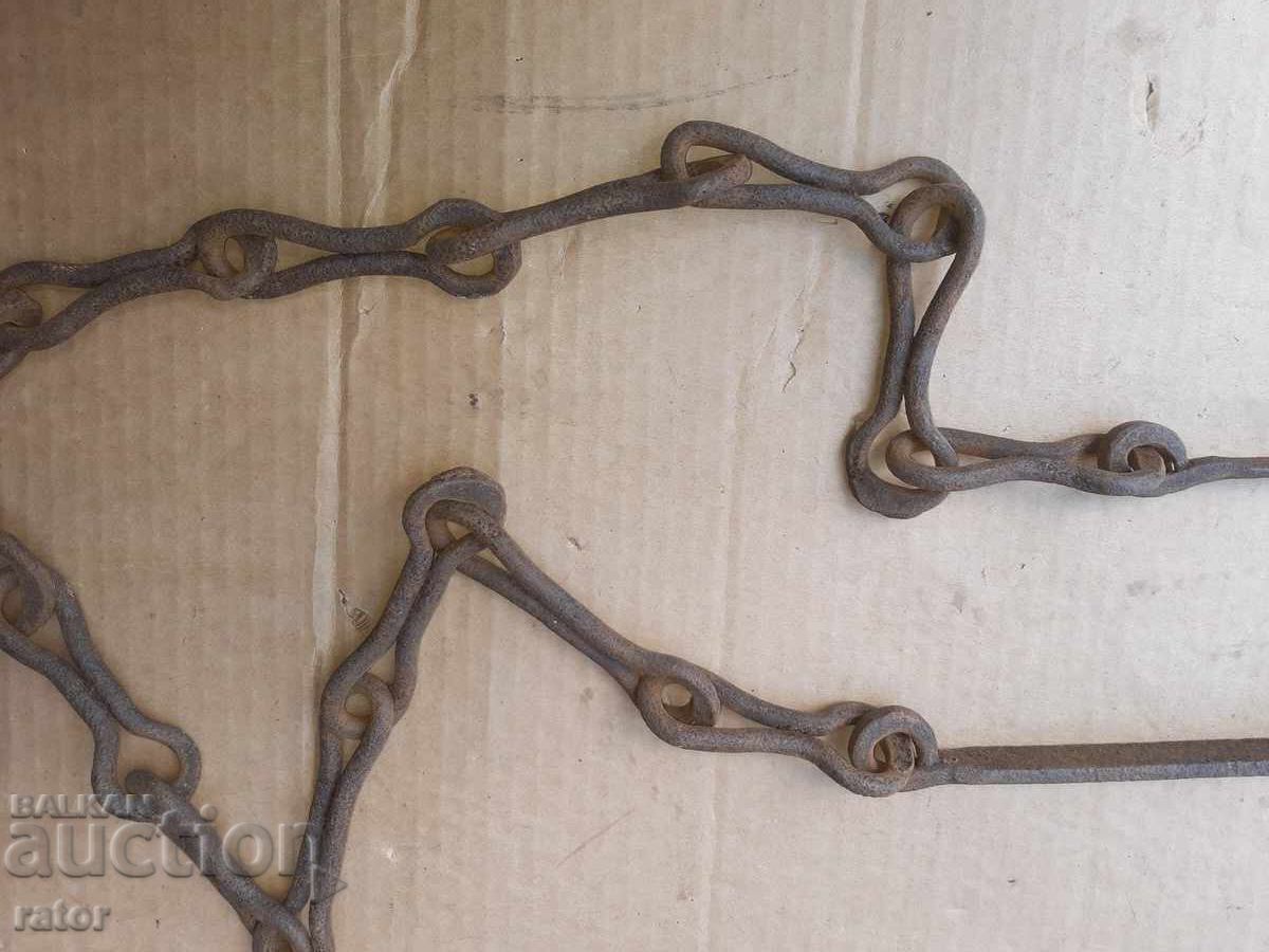 Auction  Old wrought iron fireplace chain, sturdy