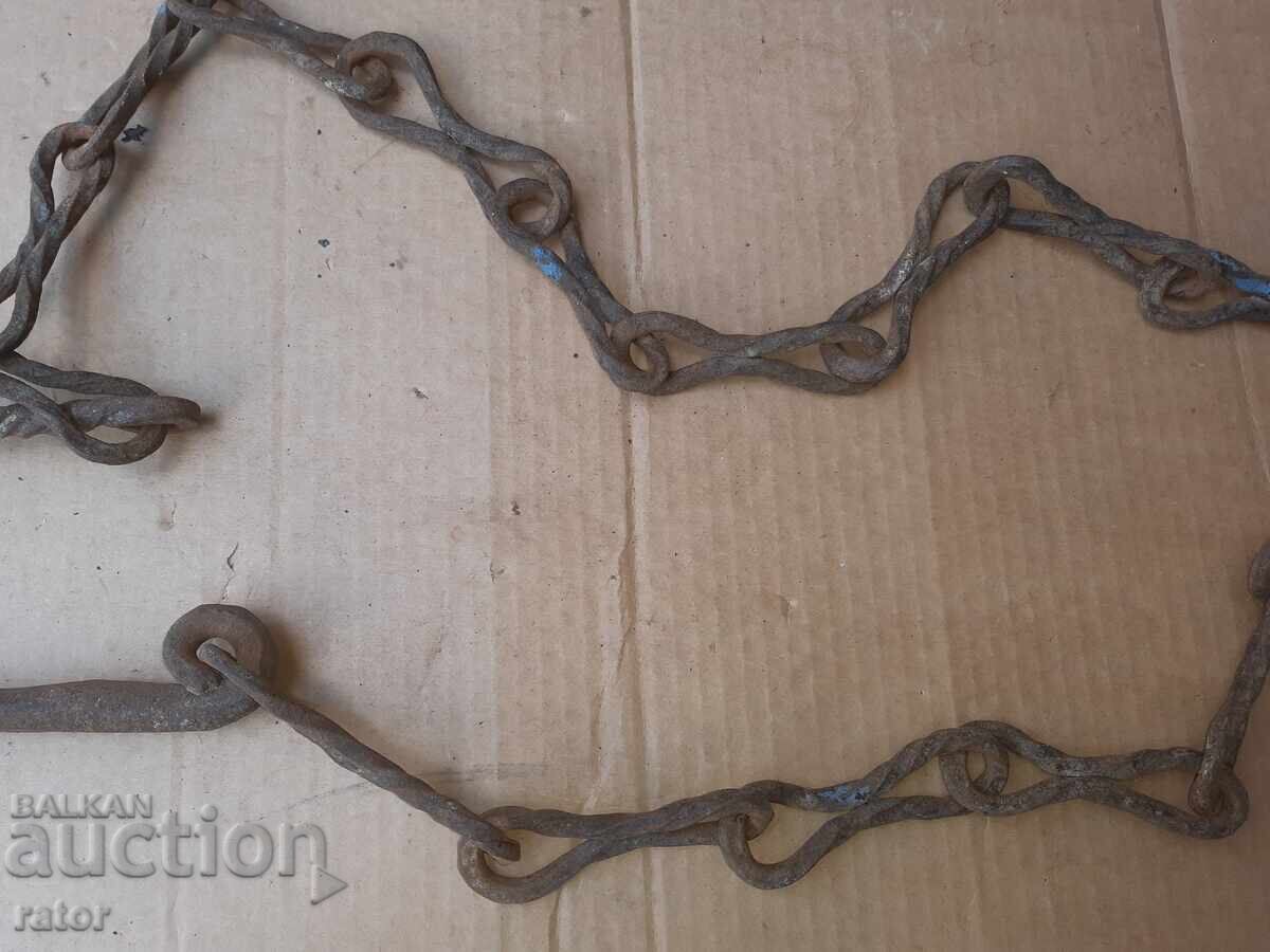 Auction  Old wrought iron fireplace chain, sturdy