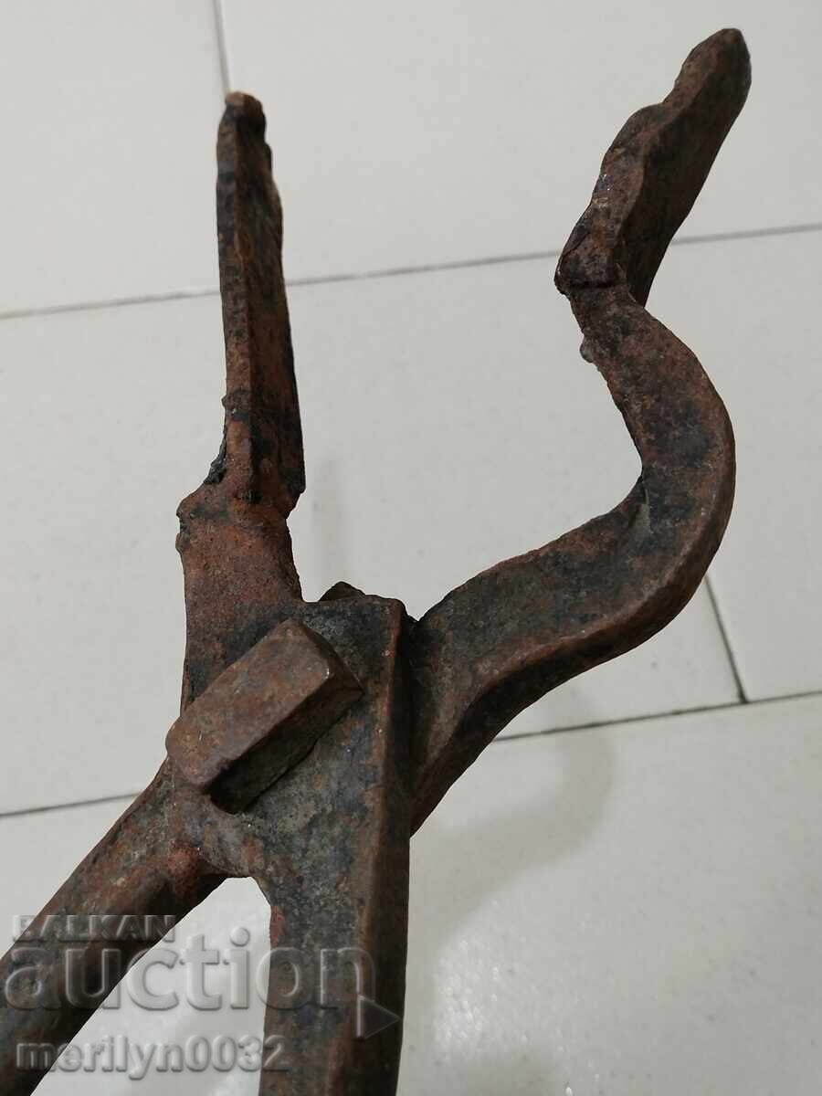 Auction  Old blacksmith's tongs, shingles, wrought iron