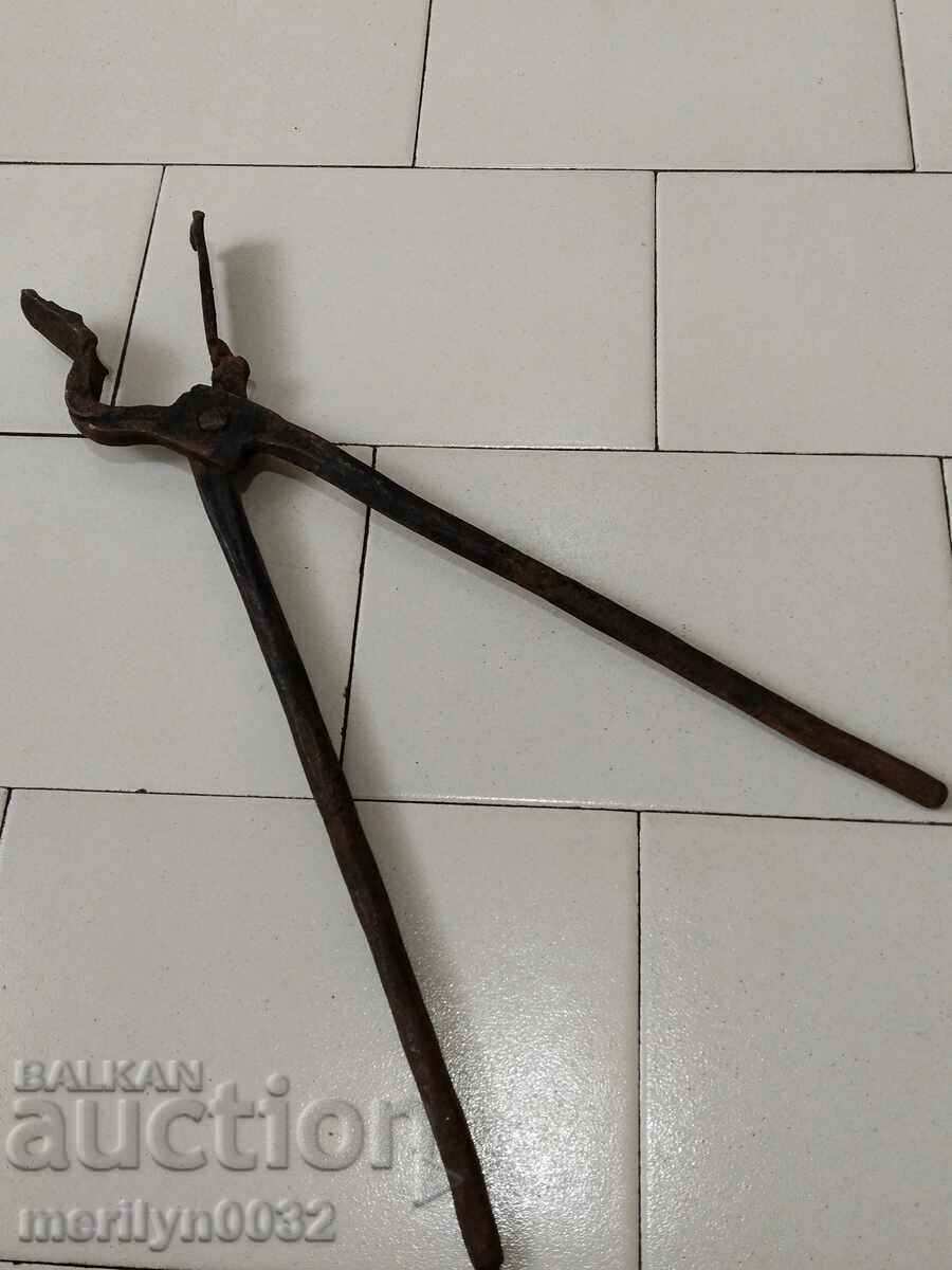 Old blacksmith's tongs, shingles, wrought iron