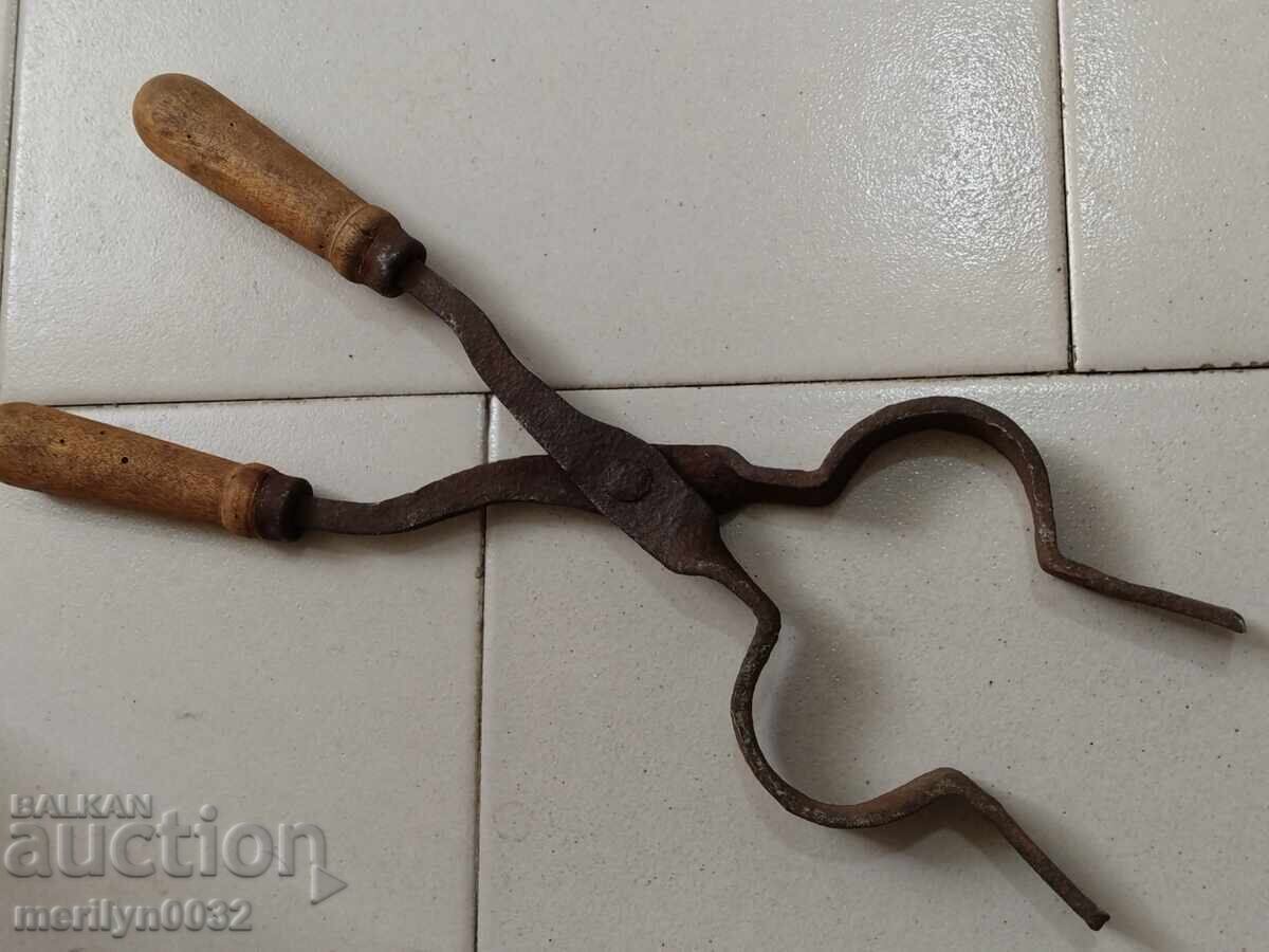 Old blacksmith's tongs, shingles, wrought iron