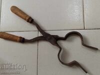 Old blacksmith's tongs, shingles, wrought iron