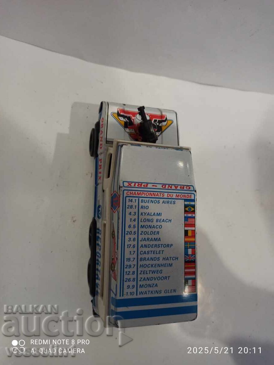 Delivery of Old toy car reporter Land Rover French jeep