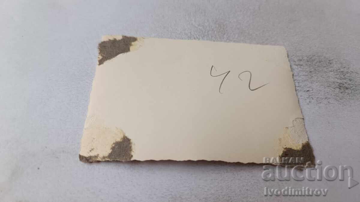 Photo of a woman sitting on a rock by the sea with price 1.45 BGN | € 0.74