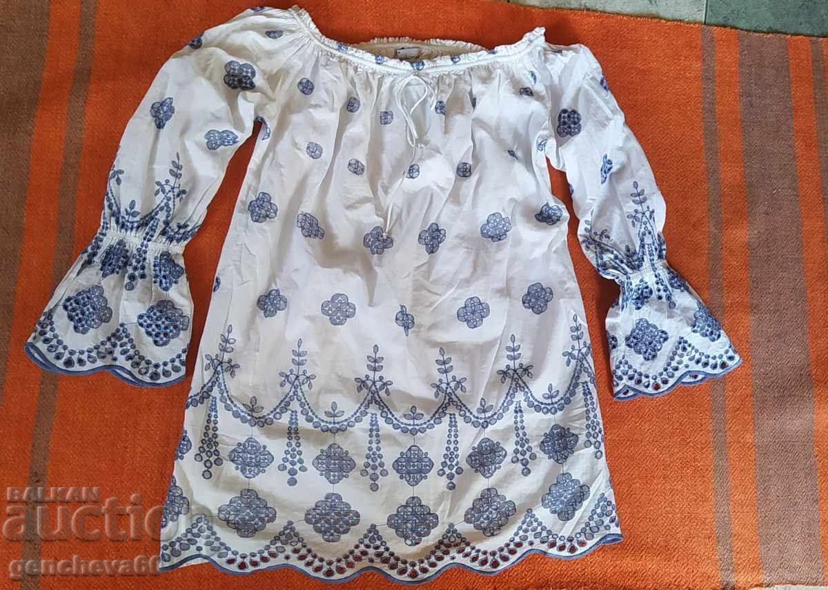 Delivery of Fashionable white long shirt with beautiful cutwork embroidery