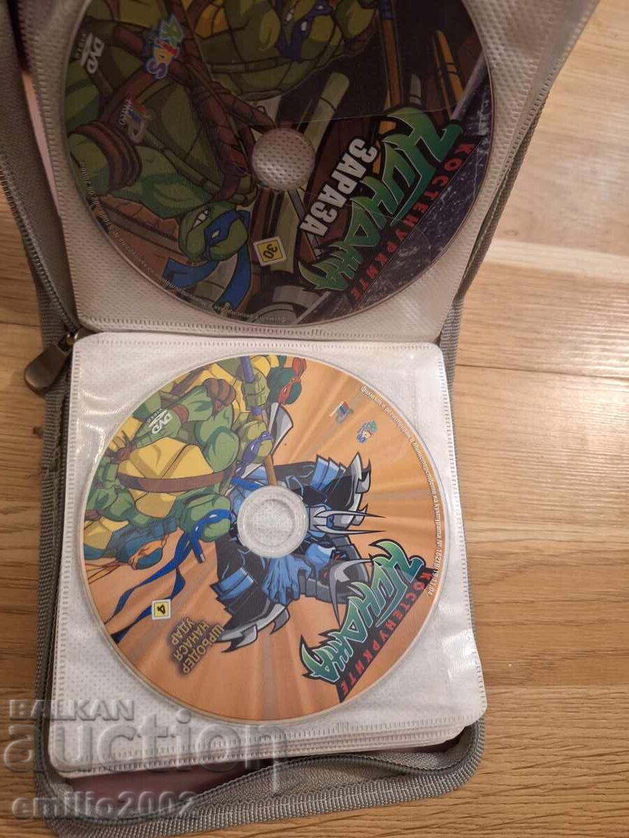 Auction  Animated DVD movies in a binder, 32 pcs
