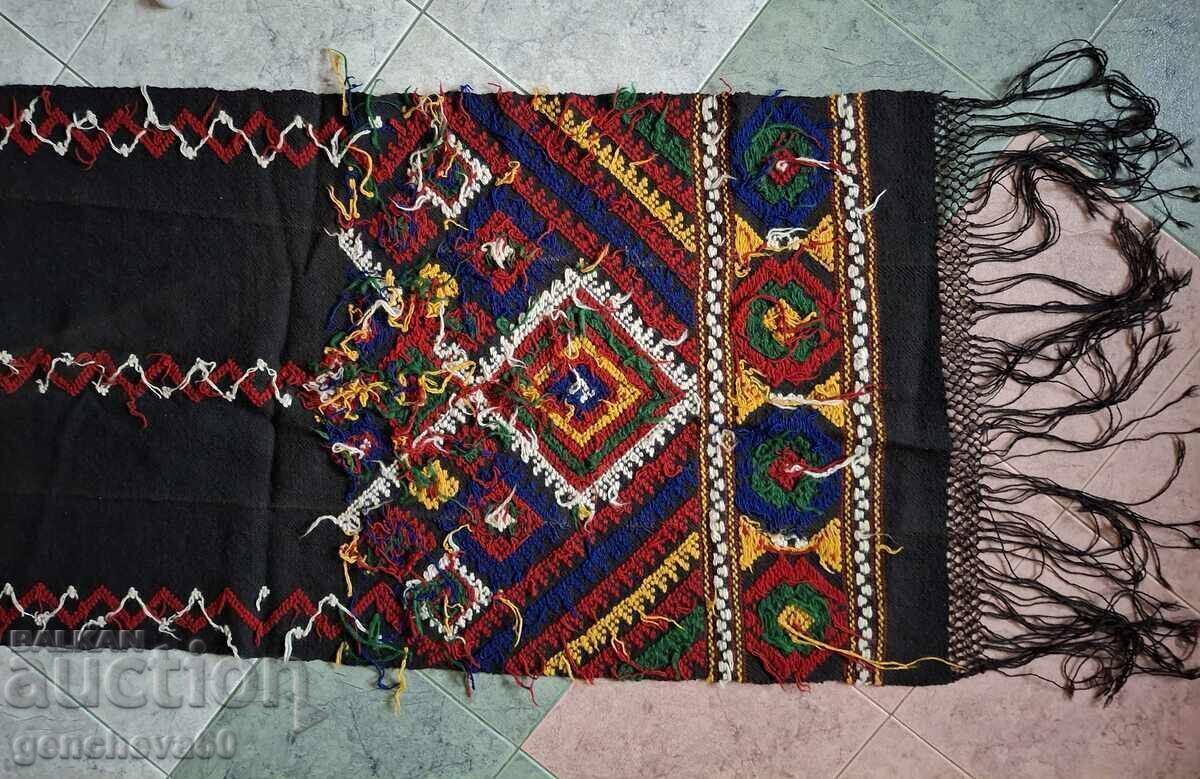 Delivery of Fucked, hand-woven colorful rug for a divan, under the roof