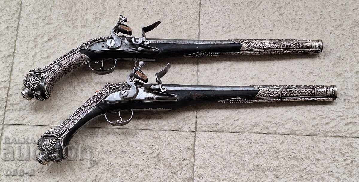 A pair of shotgun revolver pistols