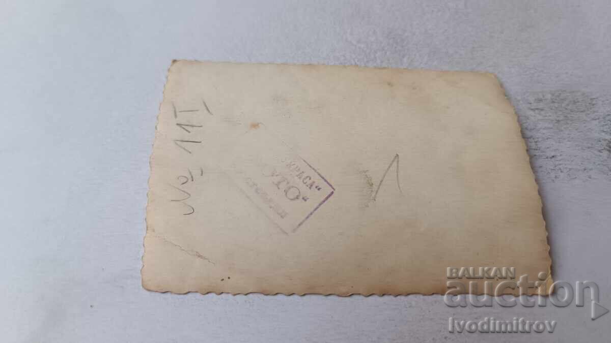 Photo Kyustendil Men and women in front of the monument of Ilio Voyvoda with price 2.35 BGN | € 1.20