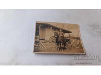 Photograph of an Officer on a Horse in the Yard of a Village House