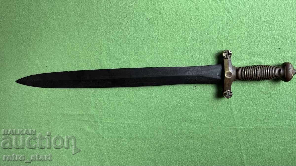 Machete with a brass handle
