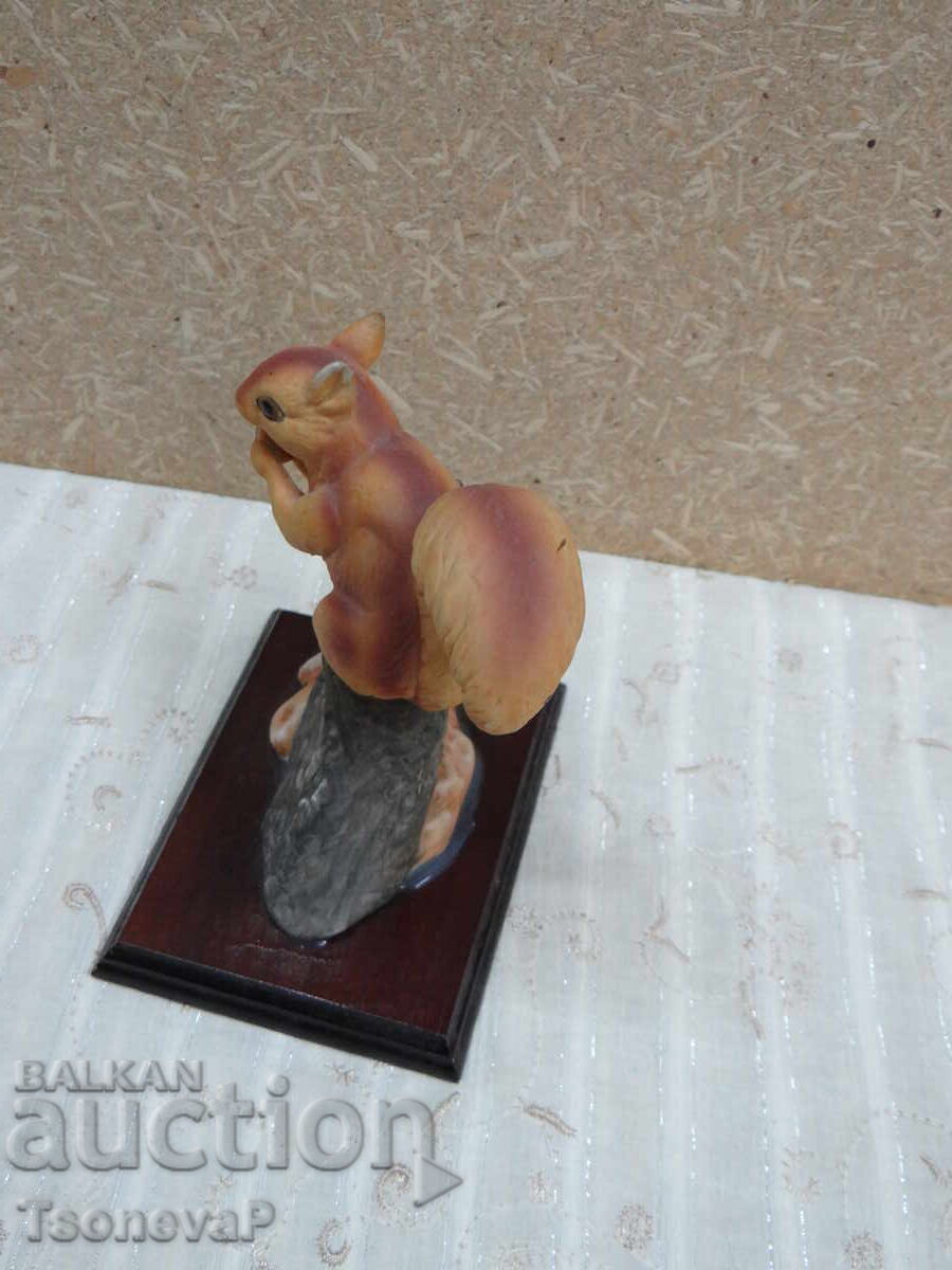 Delivery of Figurine of a red squirrel on a wooden base Delivery of Figurine of a red squirrel on a wooden base