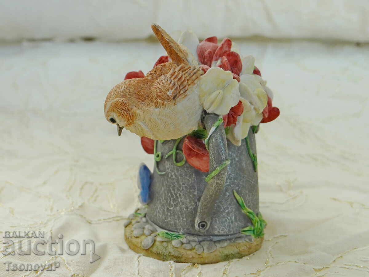 Auction Bird figurine, watering can, flowers, butterfly Auction Bird figurine, watering can, flowers, butterfly