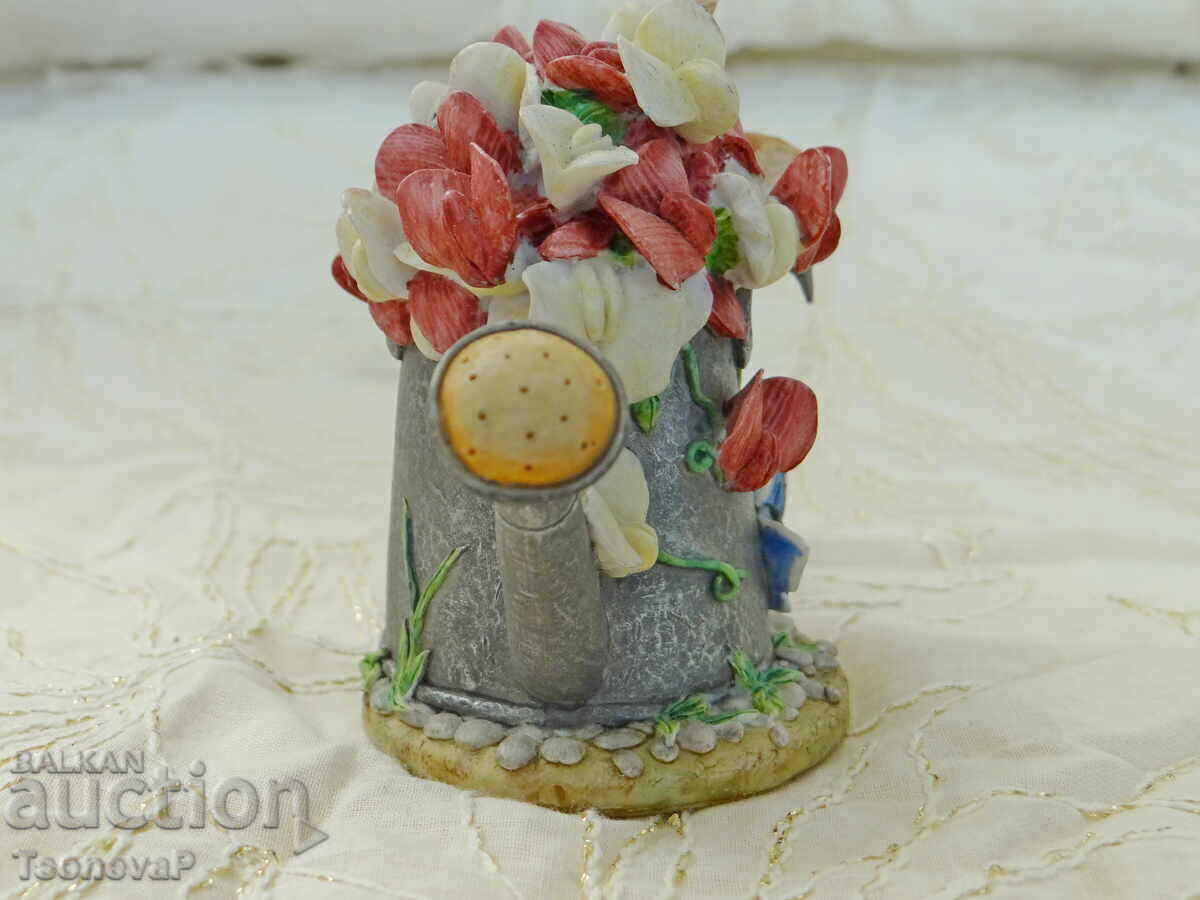 Delivery of Bird figurine, watering can, flowers, butterfly Delivery of Bird figurine, watering can, flowers, butterfly