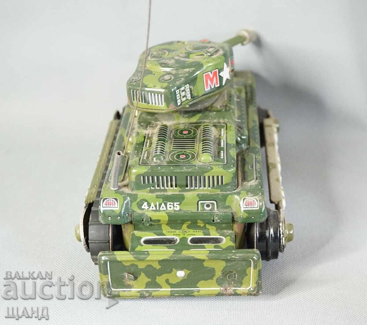 Delivery of Old Japanese metal toy model tank with batteries
