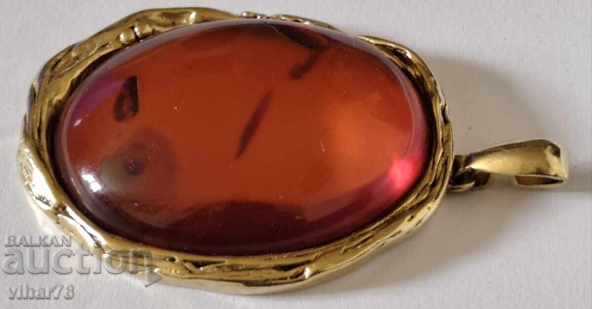 Silver pendant with gold plating and amber