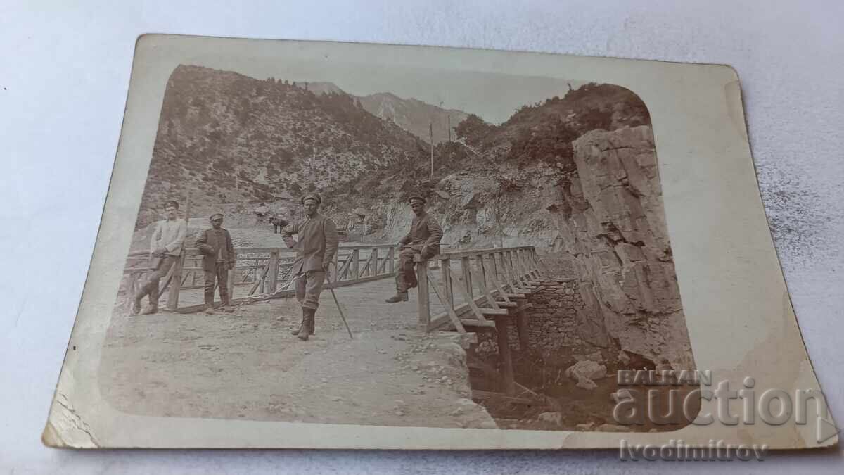 Photo of Officers on a wooden bridge over a river on the front WWI