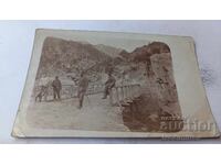 Photo of Officers on a wooden bridge over a river on the front WWI