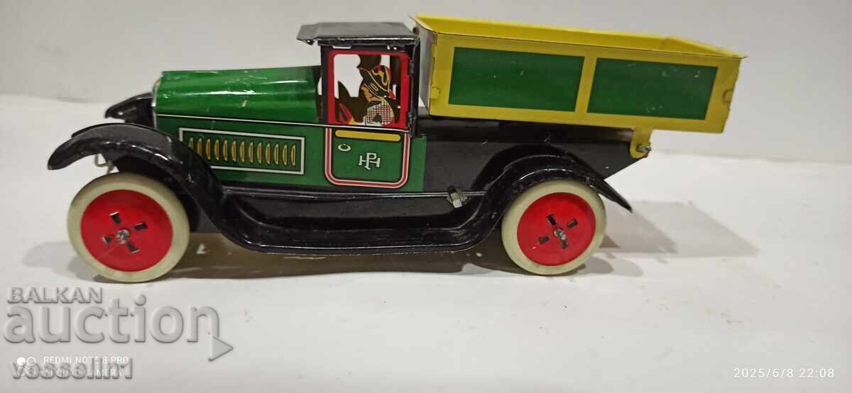 Old sheet metal truck with a wind-up friction mechanism with price 85.00 BGN | € 43.46