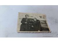 Photo Sofia Two young men next to a retro car 1942