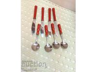 Set of spoons and knives with red wooden handles