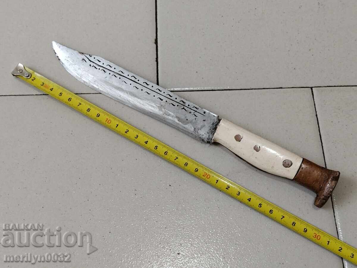Delivery of Old knife without a sheath with primitive engravings, dagger, fist