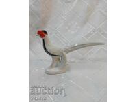A ROW OF PORCELAIN RUSSIAN FIGURE PHEASANT