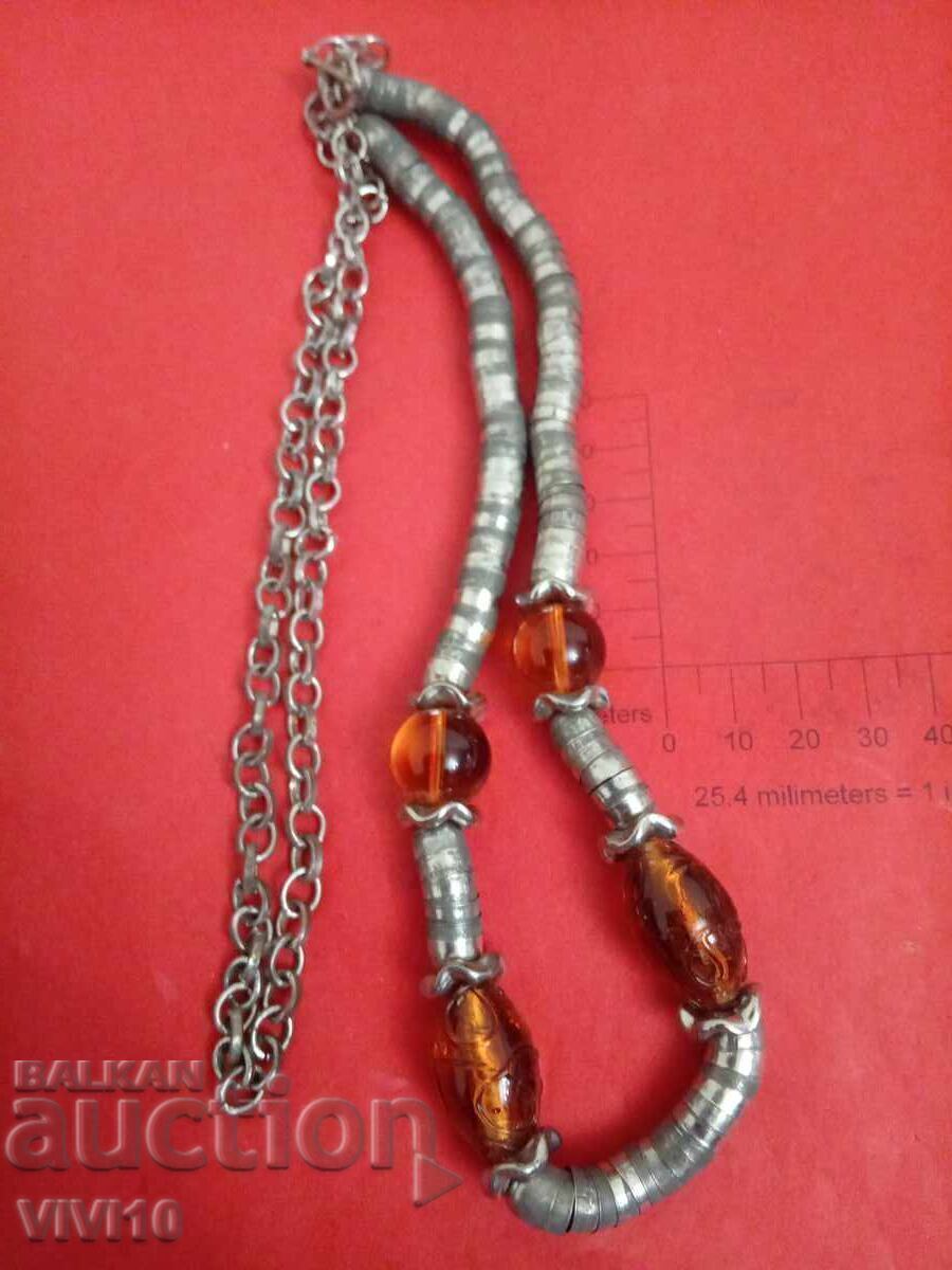 Antique necklace with metal parts