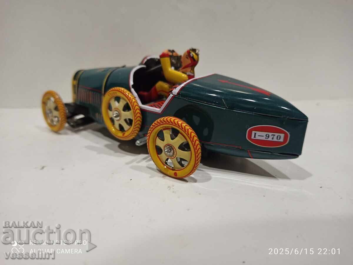 Delivery of Old sheet metal car with a wind-up friction mechanism