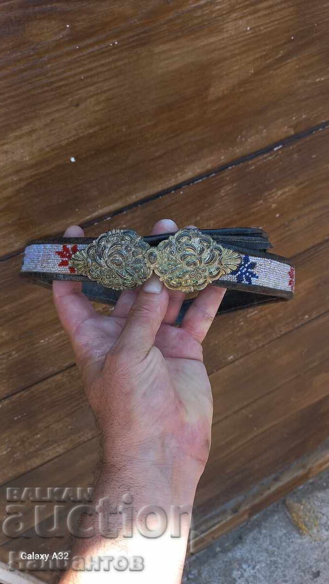 Old silver pafiti (ornamental belt buckles) with a belt Old silver pafiti (ornamental belt buckles) with a belt