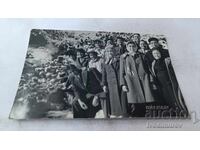 Photo of men and women by the stream near Vihren hut, 1962